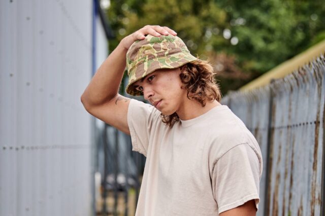 Outdoor shot of a Frogskin Camo hat